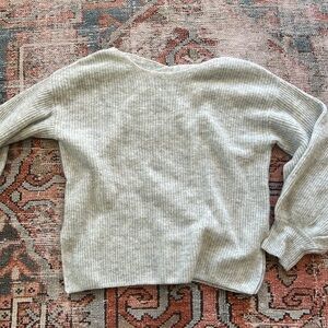 Light cream/beige colored sweater, detail crisscross back detail